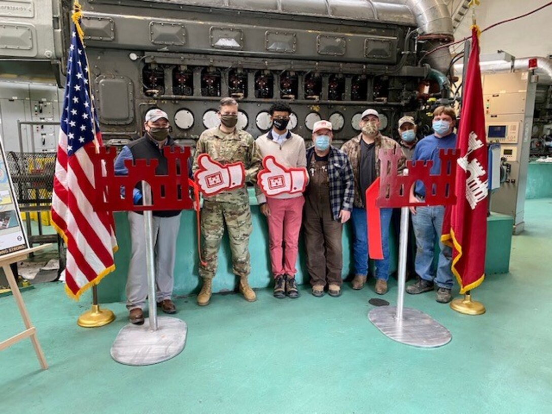 IN THE PHOTO, Memphis District Commander Col. Zachary Miller, District Partners, and other district leadership were briefed on the details of the St. Francis bridge (CR736) project at the exact site where the construction took place. Afterward, the group held a ribbon-cutting ceremony (in the photo), symbolizing the victory and celebration of completing yet another significant project. (USACE photo by Jessica Haas)