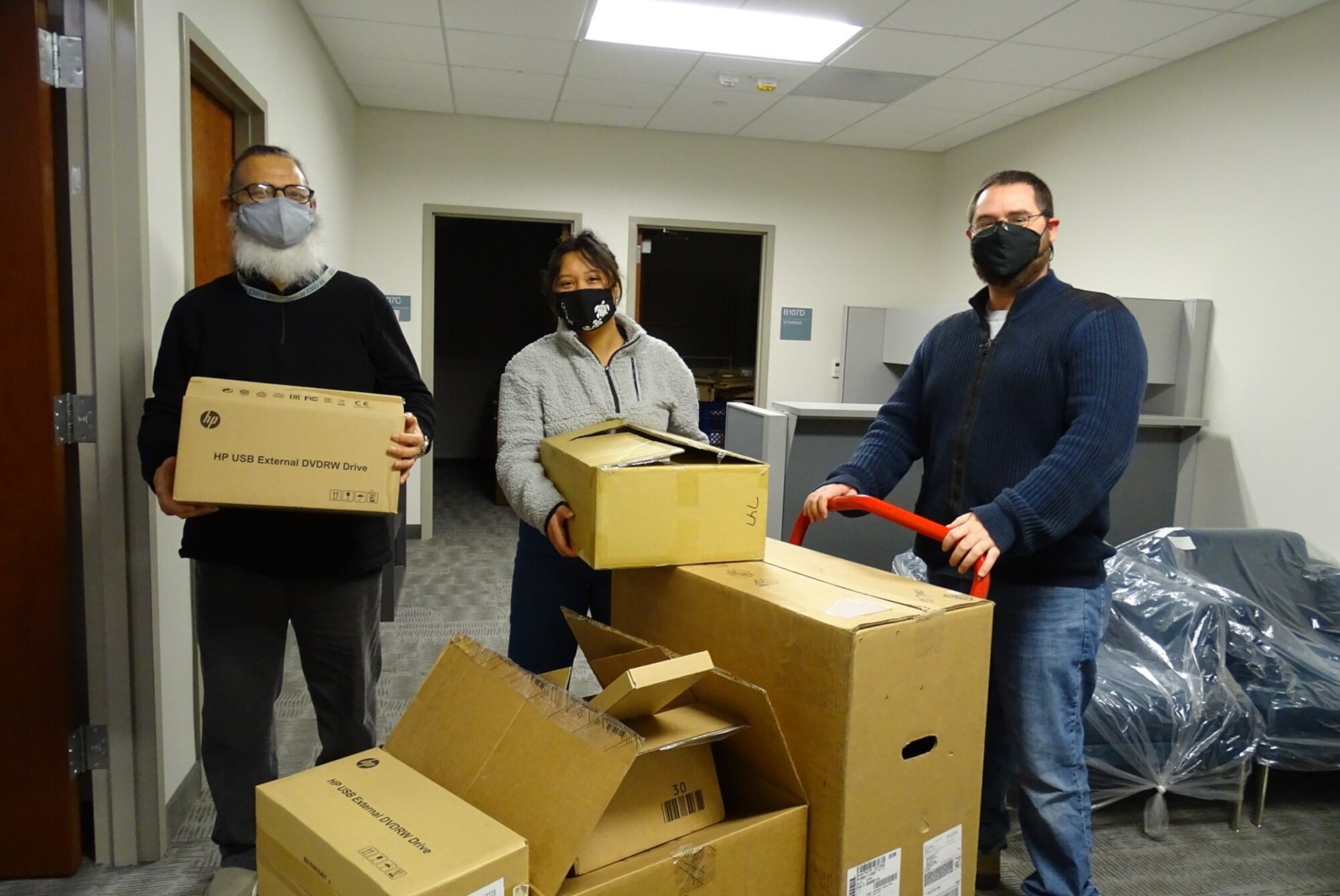 Photo of personnel moving equipment