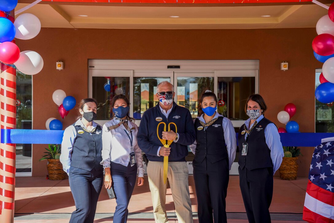 A picture of the Air Force Inns staff posing in front of the new lodging facility.