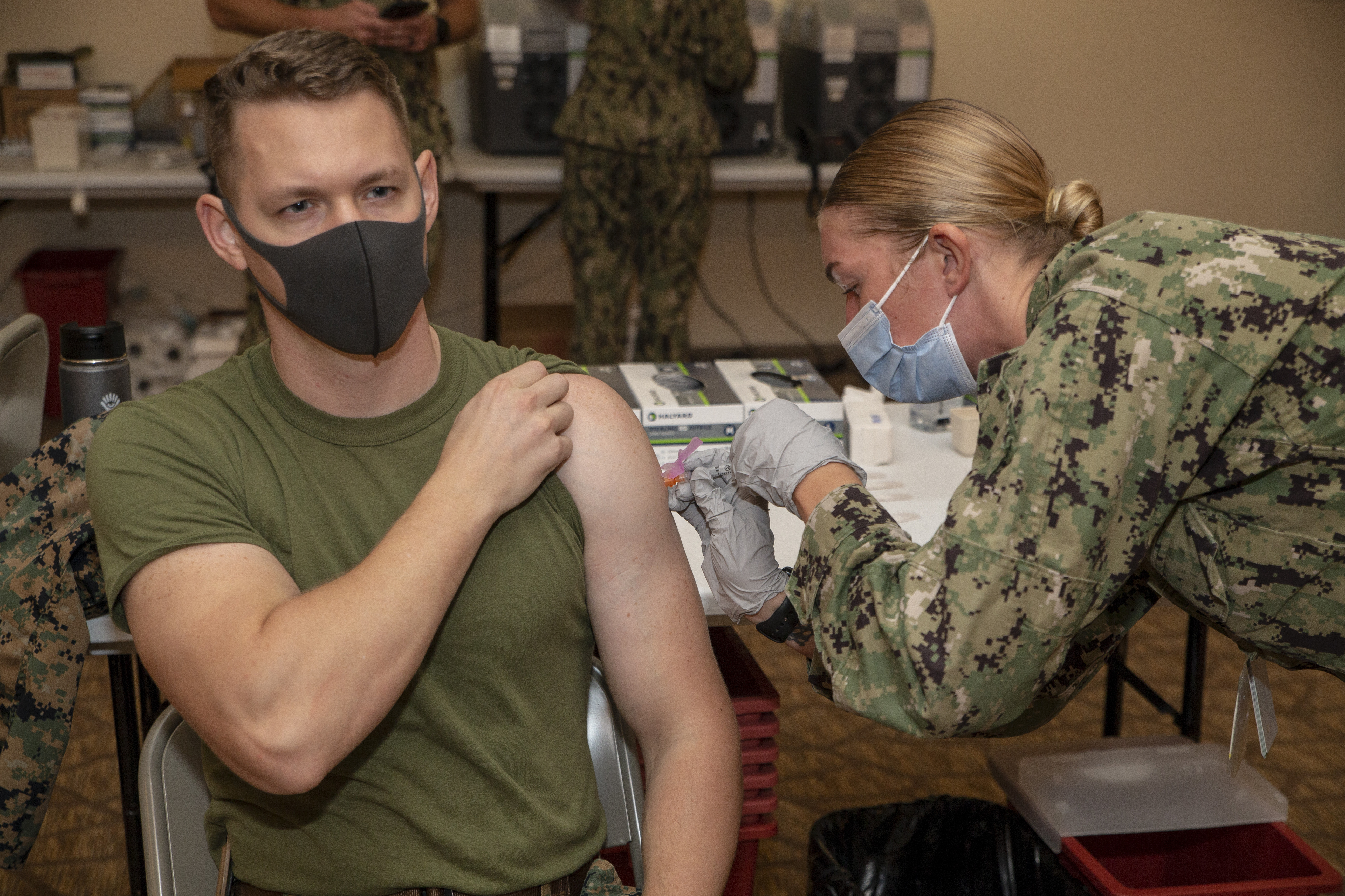 U.S. Marine Corps Capt. Joseph Osbourne receives the COVID-19 vaccine from Hospital Corpsman 2nd Class Jodee Martin, assigned to U.S. Naval Hospital Guam, Jan. 27, 2021.