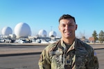 U.S. Space Force Capt. Angelo Centeno, 2nd Space Warning Squadron weapons and tactics flight commander, poses for a picture in front of the Radomes at Buckley Air Force Base, Colo., Jan. 27, 2021.