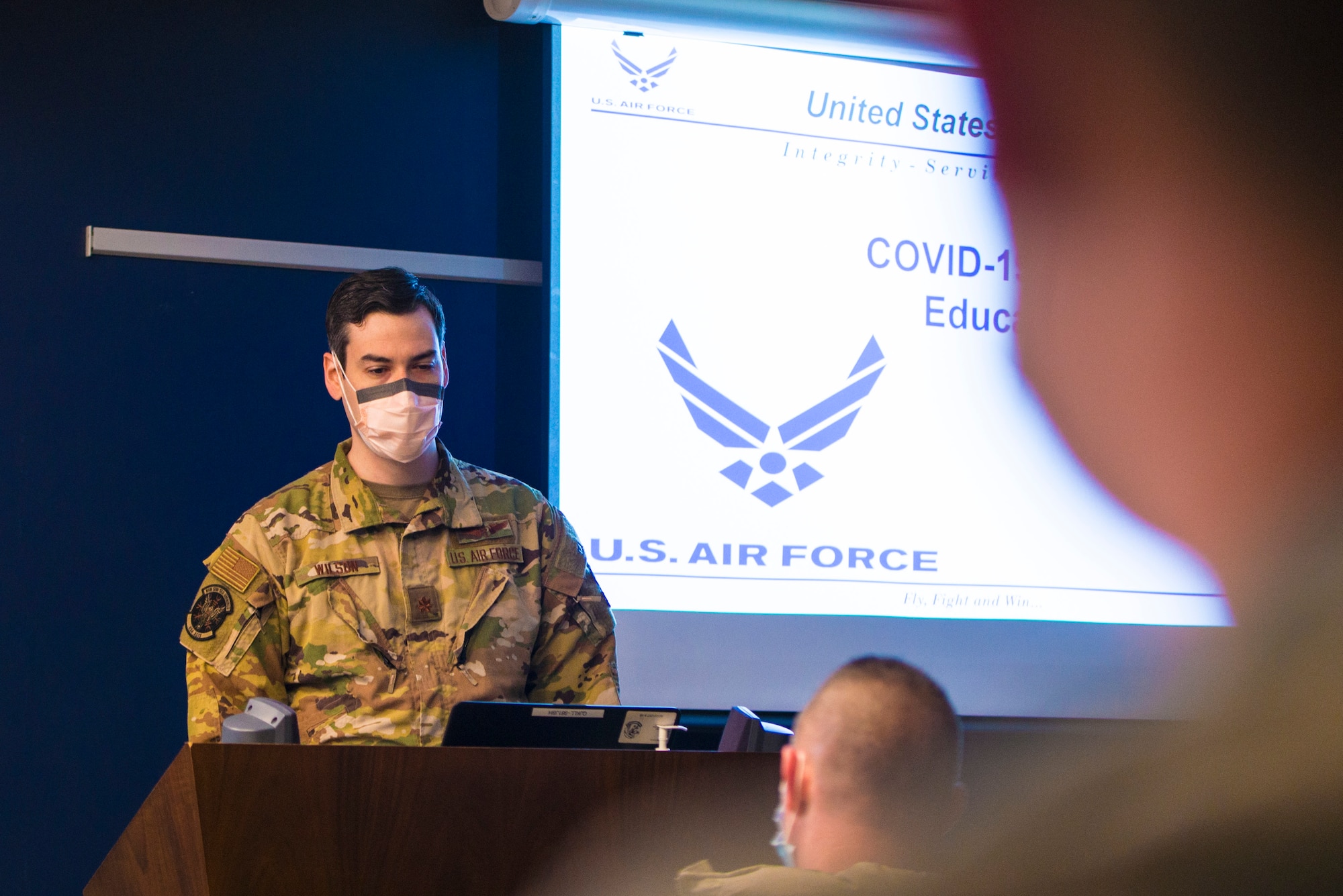 Major (Doctor) William Wilson, 934th Airlift Wing public health emergency officer, briefs 934 AW Airmen and civilians prior to receiving the COVID-19 vaccine at Minneapolis-St. Paul Air Reserve Station on Jan. 22, 2021. The 934th Airlift Wing initiated the distribution of the vaccine in an effort to combat the spread of the COVID-19 virus. (U.S. Air Force photo by Chris Farley).