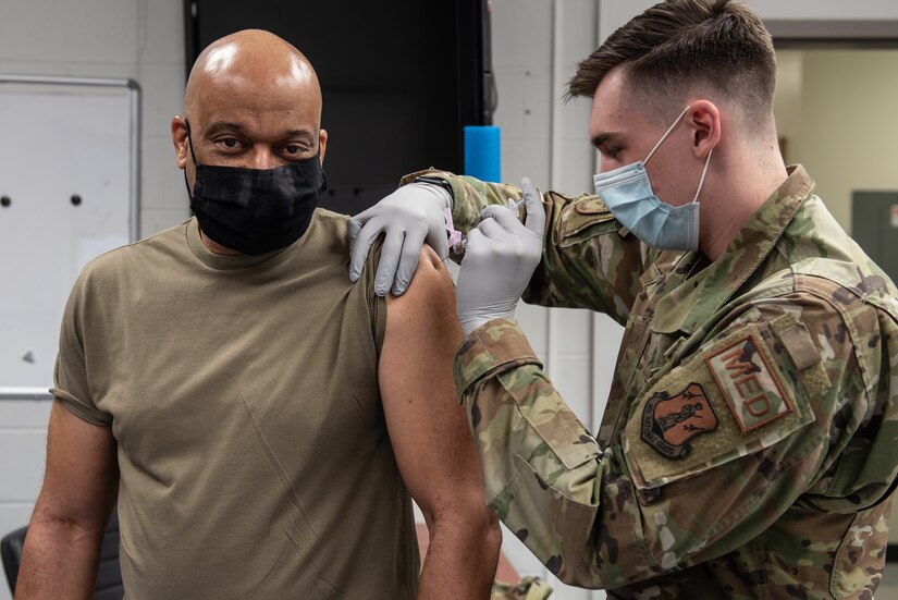 Brig. Gen. Charles Walker (left), chief of staff for Joint Forces Headquarters Kentucky — Air, receives his first COVID-19 vaccination at the Kentucky Air National Guard Base in Louisville, Ky., Jan. 10, 2021. All Kentucky Air Guard members are eligible for the vaccinations. (U.S. Air National Guard photo by Lt. Col. Allison Stephens)