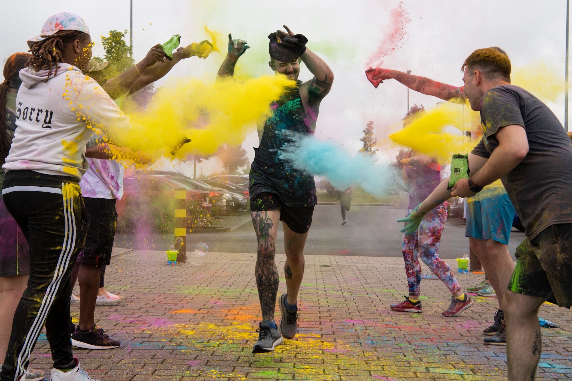 U.S. Air Force Staff Sgt. Nathan Baker, 52nd Force Support Squadron Airman Leadership School instructor, participates in a Pride color run, June 30, 2021, on Spangdahlem Air Base, Germany. Pride Month is celebrated every year to recognize and honor the Stonewall riots in 1969, a pivotal time for the lesbian, gay, bisexual, transgender, and queer community  in their fight for equality as United States citizens. (U.S. Air Force photo by Staff Sgt. Melody W. Howley)
