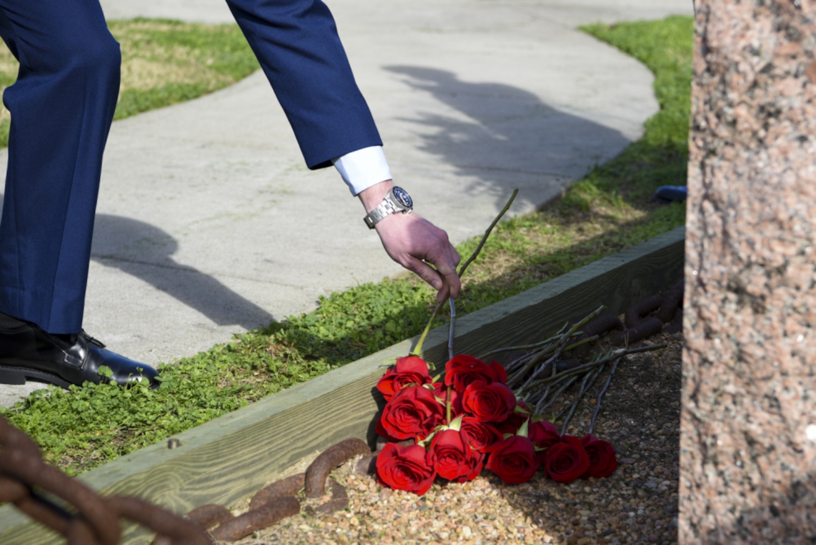 A crew member from one of Sector Houston-Galveston's underlying units lays a rose to commemorate a fallen crew member of the Coast Guard Cutter Blackthorn during the 41st-anniversary memorial service Jan. 28, 2021, at Base Galveston in Galveston, Texas. The Coast Guard Cutter Blackthorn sank after colliding with the tanker vessel Capricorn in Tampa, Florida, near the Sunshine Skyway Bridge Jan. 28, 1980 and lost 23 of its 50 crew members in the Coast Guard’s worst peacetime disaster. (U.S. Coast Guard photo by Petty Officer 2nd Class Ryan Dickinson)