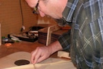 Man building a guitar