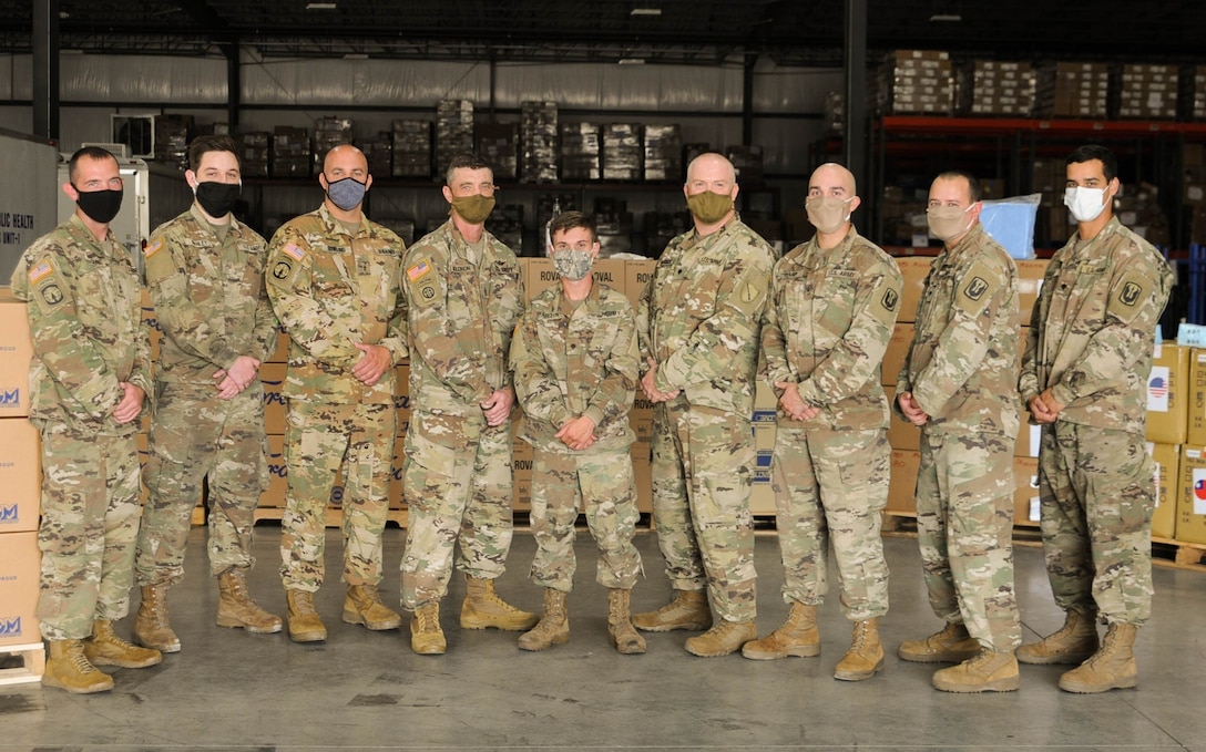 Kentucky Army National Guard troops pause for a photo at the supply warehouse in Frankfort, Ky., Sept. 10, 2020.