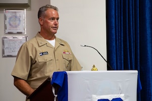 210701-N-IO414-1007 NAVAL SUPPORT ACTIVITY BAHRAIN (July 1, 2021) - Capt. Michael O’Driscoll, outgoing commander of Task Force (TF) 53, delivers remarks during a change of command ceremony onboard Naval Support Activity Bahrain, July 1. TF 53 coordinates replenishment-at-sea efforts and delivers passengers, mail, cargo, ammunition, provisions and fuel throughout the 5th Fleet area of operations via air, land and sea modes, helping to ensure Sailors aboard ships have what they need to complete their missions. (U.S. Navy photo by Mass Communication Specialist 2nd Class Jordan Crouch)