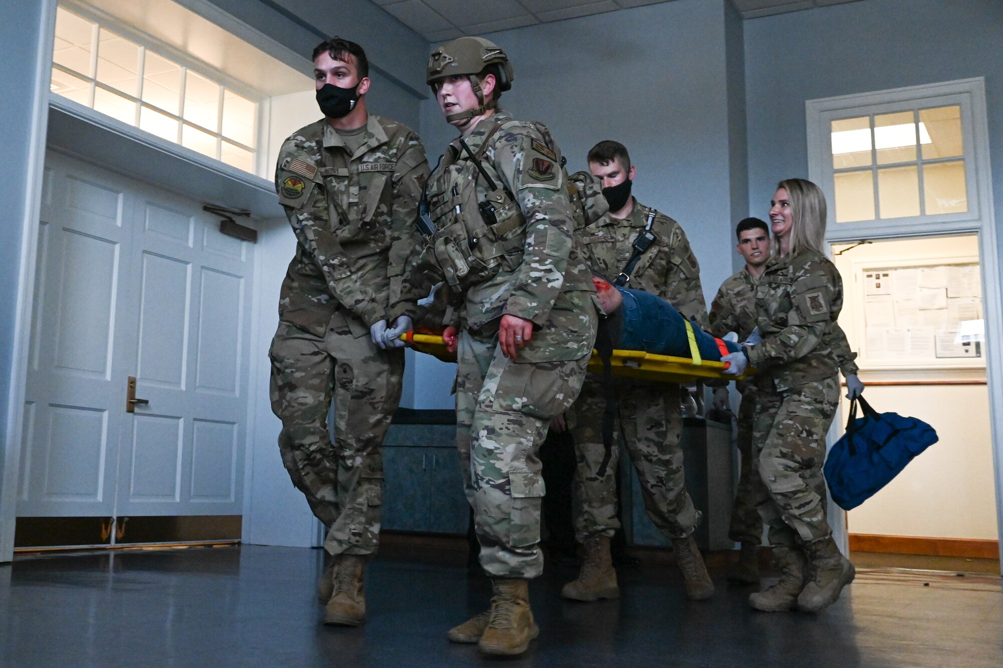 Airmen assigned to the 633rd Security Forces
Squadron and 633rd Medical Group, rescue a
simulated victim during an active shooter
exercise at Joint Base Langley-Eustis,
Virginia, June 24, 2021. The exercise was
used to train on readiness tactics for security
forces and medical personnel.