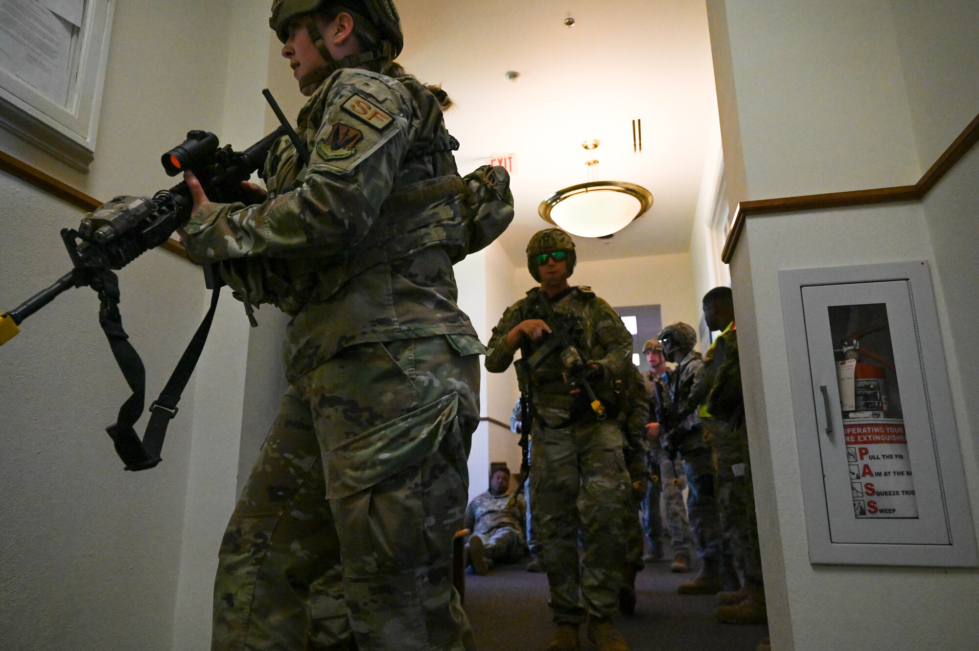 Staff Sgt. Ariel Shannon and Senior Airman
Benjamin Richards, 633rd Security Force
Squadron response force team, simulate
building clearing tactics during an active
shooter exercise at Joint Base
Langley-Eustis, Virginia, June 24, 2021. This
exercise tested readiness tactics for security
forces and supporting agencies.