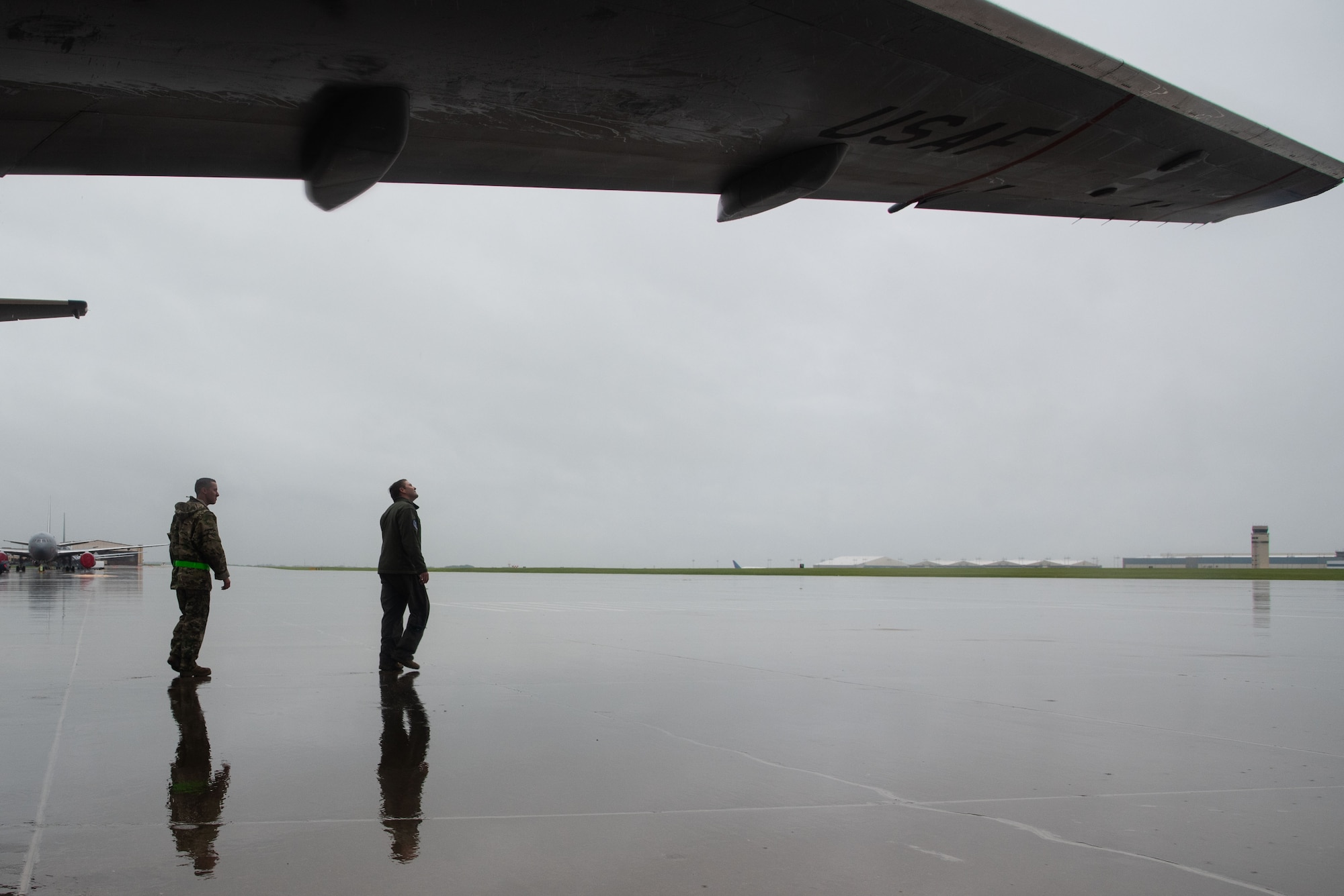 U.S. Air Force Staff Sgt. Eric Yates, 22nd Aircraft Maintenance Squadron crew chief, and Capt. Marcus Watson, 344th Air Refueling Squadron, conduct an exterior pre-flight inspection at McConnell Air Force Base, Kansas, June 30, 2021. Pre-flight inspections require aircrews to perform visual checks of controls and instruments prior to starting engines. (U.S. Air Force photo by Airman 1st Class Zachary Willis)