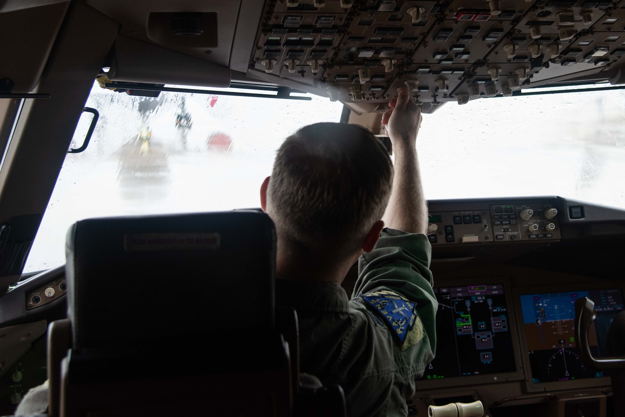 U.S. Air Force Capt. Bryant Bailey, 344th Air Refueling Squadron, preforms a flight deck pre-flight inspection at McConnell Air Force Base, Kansas, June 30, 2021. During a pre-flight check, aircrew members test equipment to ensure everything functions properly before takeoff. (U.S. Air Force photo by Airman 1st Class Zachary Willis)