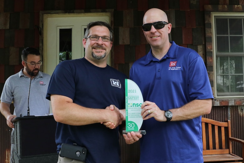 Col. Mark Himes (right), commander, U.S. Army Corps of Engineers, Omaha District presents the National Safety Council, Nebraska Chapter’s Safest Companies with Distinction Award to Jeff Skrivanek (left), District Chief of Safety and Occupational Health during the Corps Day awards ceremony June 18.