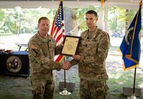 Incoming Product Manager Soldier Precision Targeting Devices, Lt. Col. Aaron Pearsall receives the Product Manager Soldier Precision Targeting Devices Charter from Col. Copeland., during a Change of Charter ceremony held at Fort Belvoir, VA.