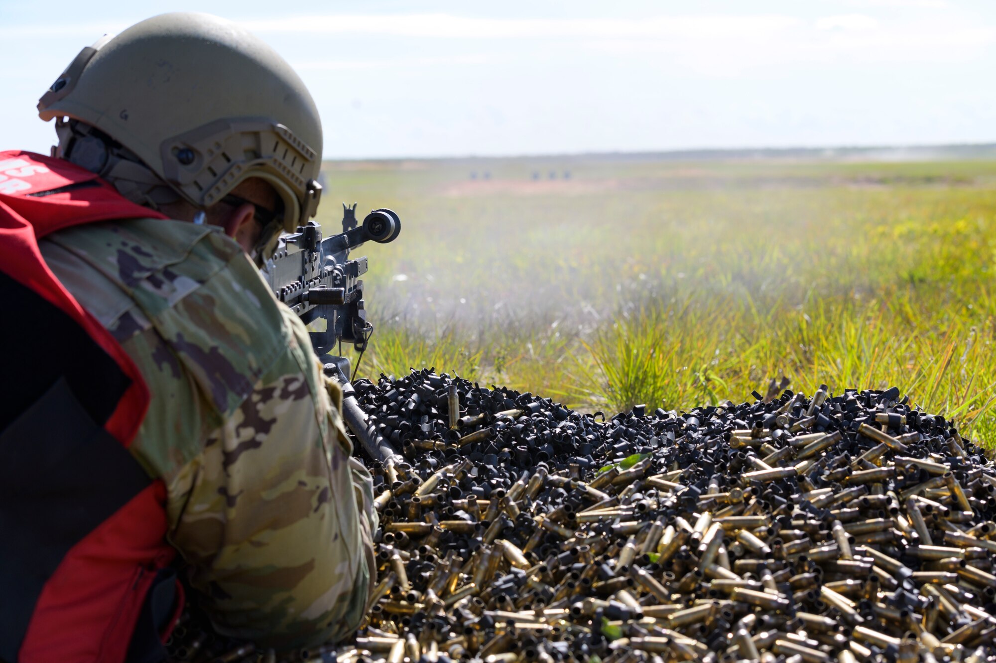 U.S. Air Force Tech. Sgt. Alan Glaze, noncommissioned officer in charge of combat arms with the 116th Security Forces Squadron, Georgia Air National Guard, fires an M240B machine gun during a live-fire training exercise at Eglin Air Force Base, Florida, May 17, 2021.