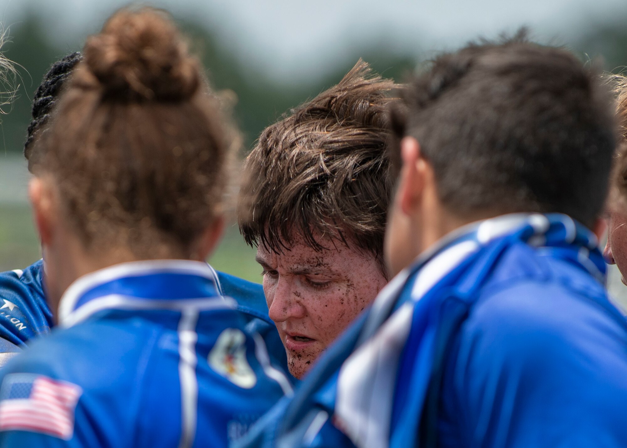 Capt. Robin Dodge, United States Air Force rugby player, meets for a team huddle during half time at the Annual Armed Forces Women’s Rugby Championship in Wilmington, North Carolina, June 26, 2021.