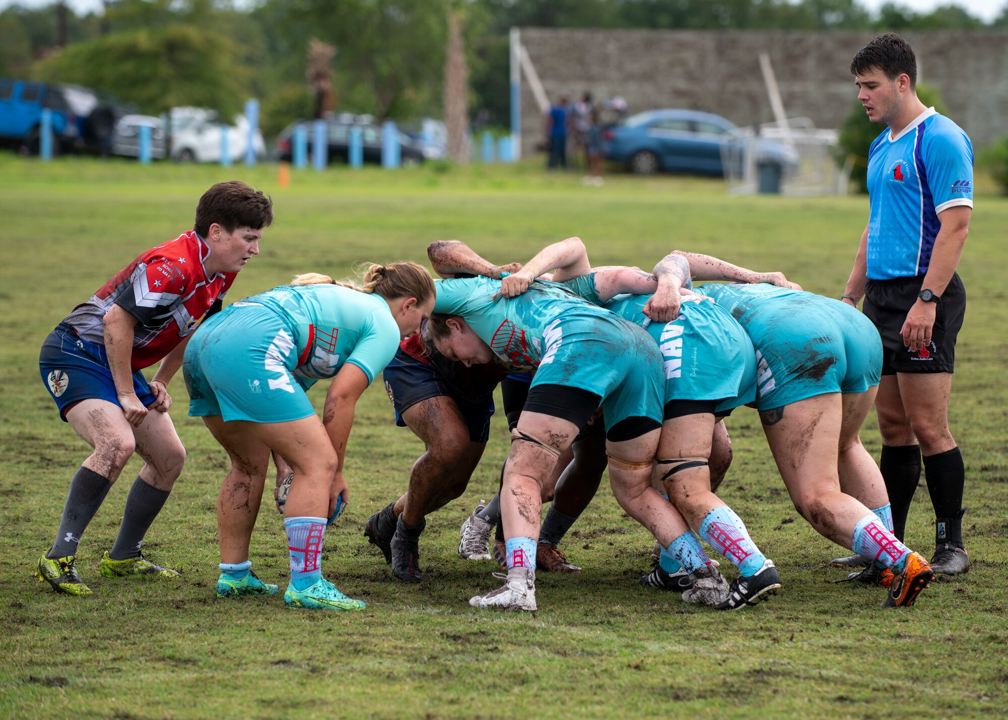 United States Air Force and Navy rugby player form a scrum at the Annual Armed Forces Women’s Rugby Championship in Wilmington, North Carolina, June 26, 2021.