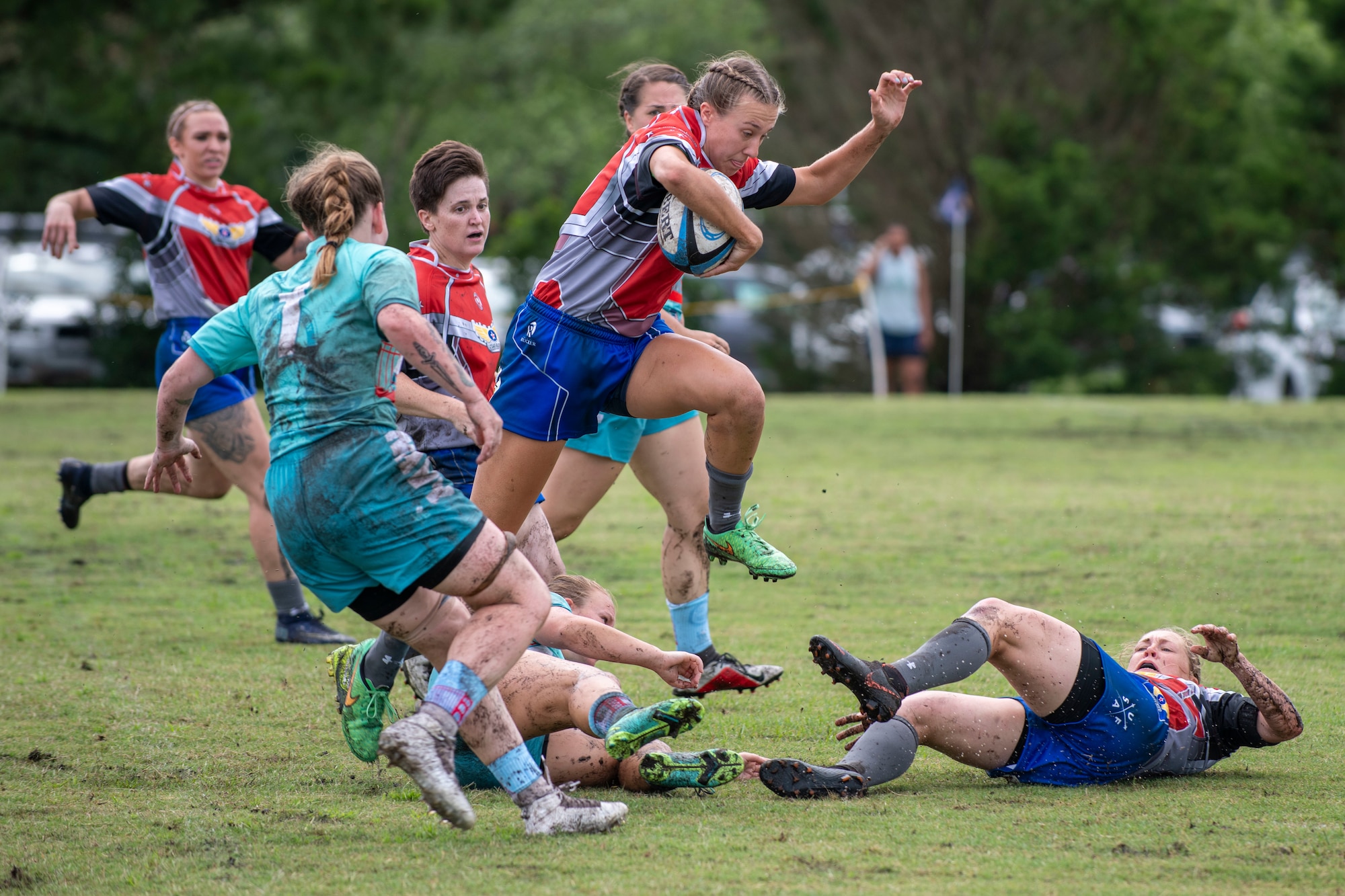 Second Lt. Adrienne Yoder, a United States Air Force rugby player, runs with the ball at the Annual Armed Forces Women’s Rugby Championship in Wilmington, North Carolina, June 26, 2021.