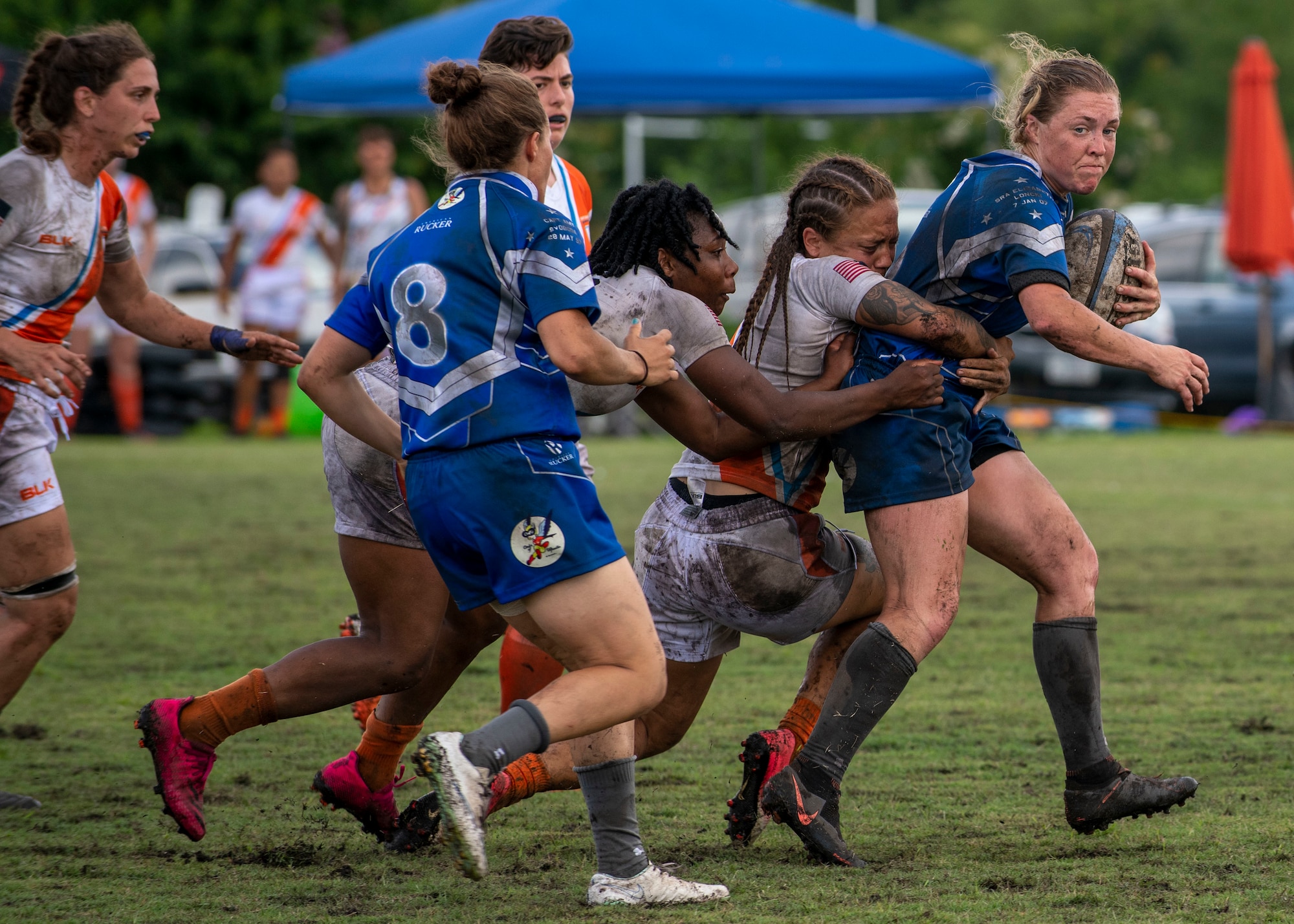 Second Lt. Adrienne Yoder, right, United States Air Force rugby player, runs with the ball during a rugby match against the United States Coast Guard at the Annual Armed Forces Women’s Rugby Championship in Wilmington, North Carolina, June 26, 2021.