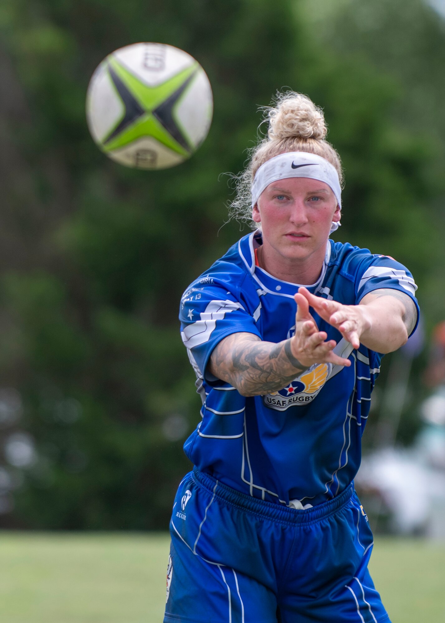 Staff Sgt. Camille Bartlett, United States Air Force women’s rugby player, passes the ball at the Annual Armed Forces Women’s Rugby Championship in Wilmington, North Carolina, June 26, 2021.