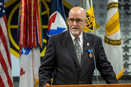 G. Eric Reid, a recently retired U.S. Army Financial Management Command Military Pay Operations director, delivers remarks after receiving an Army Distinguished Civilian Service Medal during a special ceremony at the Maj. Gen. Emmett J. Bean Federal Center in Indianapolis May 26, 2021. Reid retired earlier in the year with more than 41 years of combined military and civilian service. (U.S. Army photo by Mark R. W. Orders-Woempner)