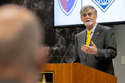 Greg Bitz, a retired member of the Senior Executive Service, speaks to G. Eric Reid, USAFMCOM Military Pay Operations director, while officiating Reid’s retirement ceremony at the Maj. Gen. Emmett J. Bean Federal Center in Indianapolis March 24, 2021. Reid retired with more than 41 years of combined military and civilian service. (U.S. Army photo by Mark R. W. Orders-Woempner)