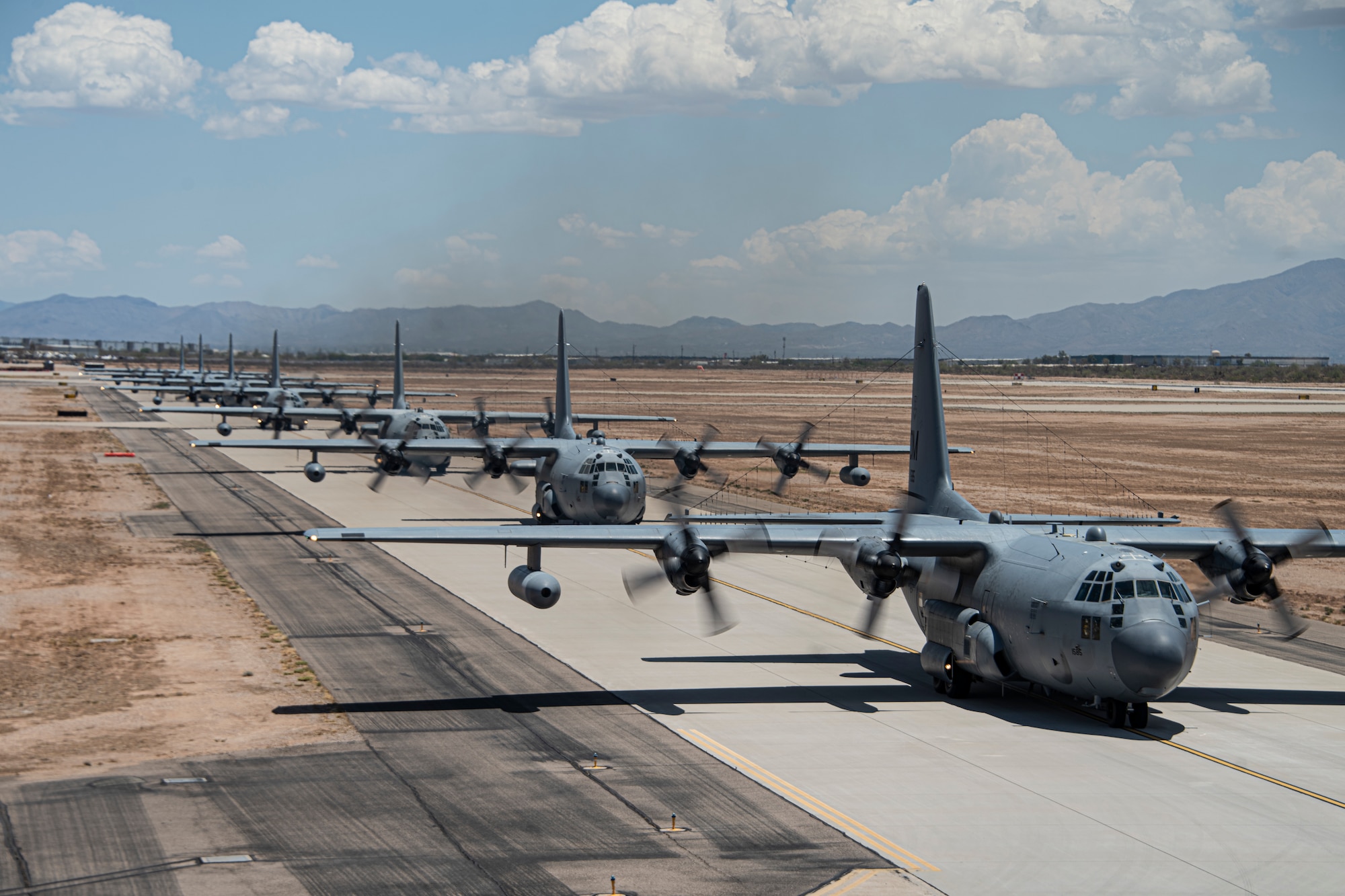 A photo of aircraft taxiing down a runway