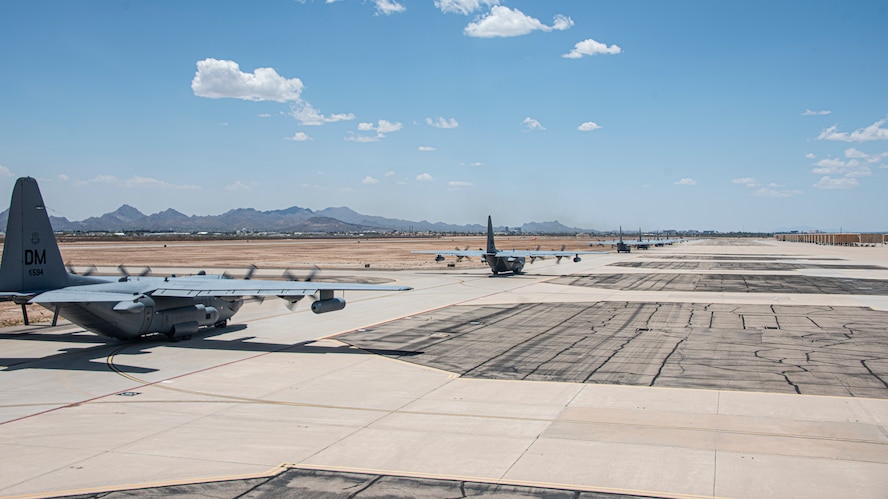 A photo of aircraft taxiing down a runway