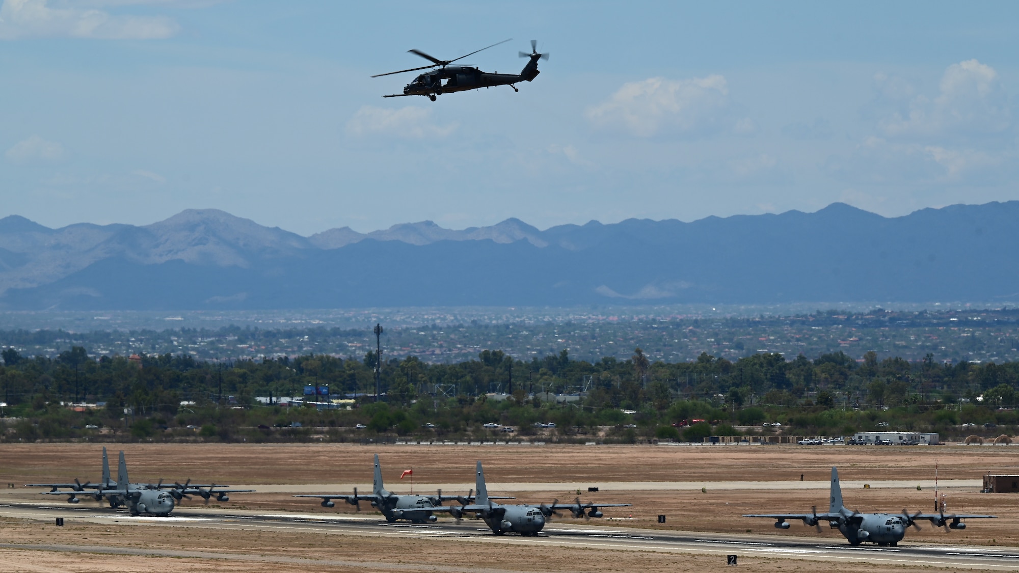 A photo of aircraft taxiing down a runway