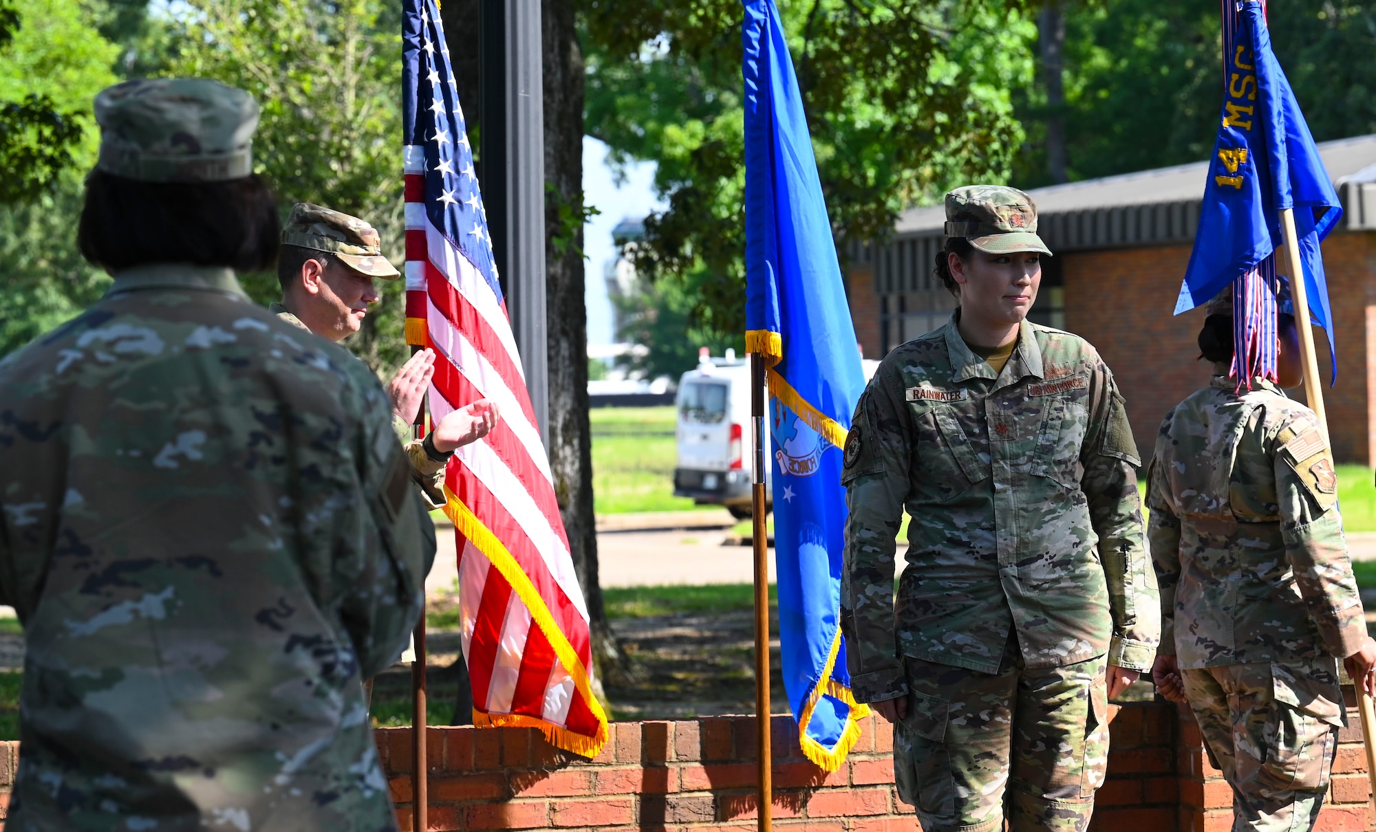 U.S. Air Force Maj. Elizabeth Rainwater, stands at attention as she is recognized as the new 14th Communications Squadron commander, Jul. 1, 2021, on Columbus Air Force Base.  The Communications Squadron successfully built a 1.6 million technology investment program project for the future T-7 aircraft and its bed down at CAFB. (U.S. Air Force photo by Airman 1st Class Jessica Haynie)