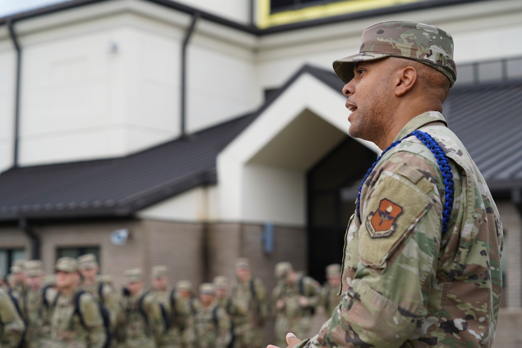 U.S. Air Force Tech. Sgt. Alvin Morris, 336th Training Squadron master military training leader, talks to Airmen in training outside of Smith Manor on Keesler Air Force Base, Mississippi, June 29, 2021. “I’ve been empowered with the tools to mold Airmen to be successful and to also challenge them to grow,” said Morris. “Understanding this pivotal role and short amount of time that I have to impact each Airman keeps me ready to mentor, train and lead at all times. Developing our Airmen, and watching them grow into leaders is very fulfilling for my position.” (U.S. Air Force photo by Senior Airman Spencer Tobler)