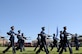 Airmen of the U.S. Air Force Honor Guard perform a pass in review during the Air Force Honor Guard change of command ceremony at Joint Base Anacostia-Bolling, June 29, 2021.  During the ceremony, U.S. Air Force Lt. Col. Jason Woodruff relinquished command to Lt. Col. Nathan Zahn, the U.S. Air Force Honor Guard inbound commander. (U.S. Air Force photo by Tech. Sgt. Corey Hook)