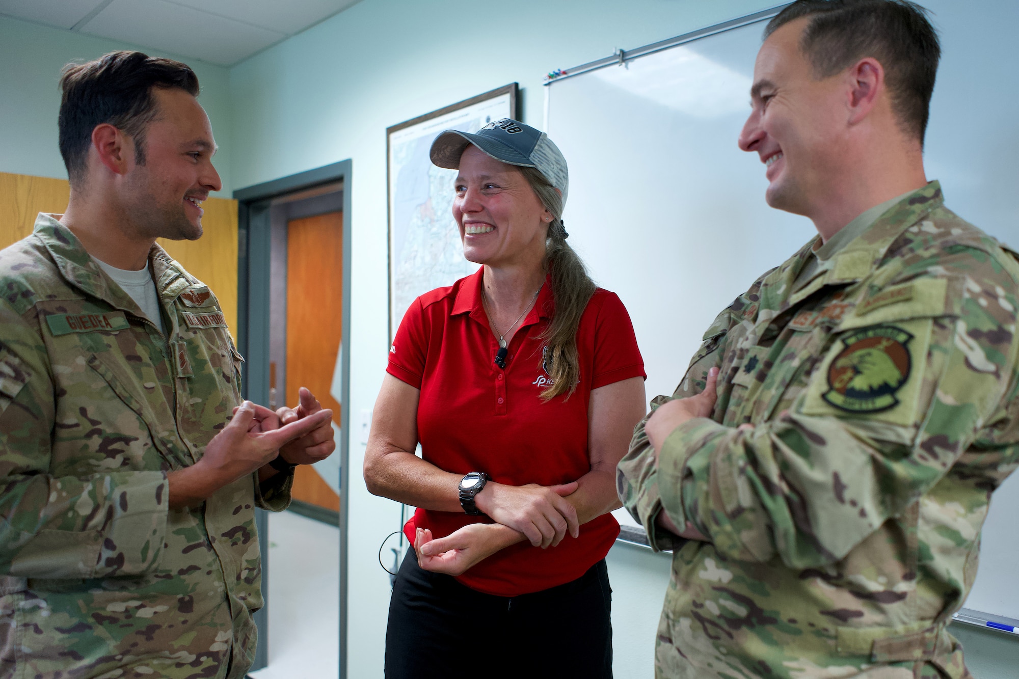 Alaska Air National Guardsmen of 210th Rescue Squadron, Tech. Sgt. Anthony Guedea (left) and Lt. Col. Michael Jordan meet with Iditarod musher Aliy Zirkle June 28, 2021, at Joint Base Elmendorf-Richardson, Alaska. Guedea and Jordan were part of the team that rescued Zirkle March 9 at the Iditarod Rohn checkpoint after she suffered a head injury.