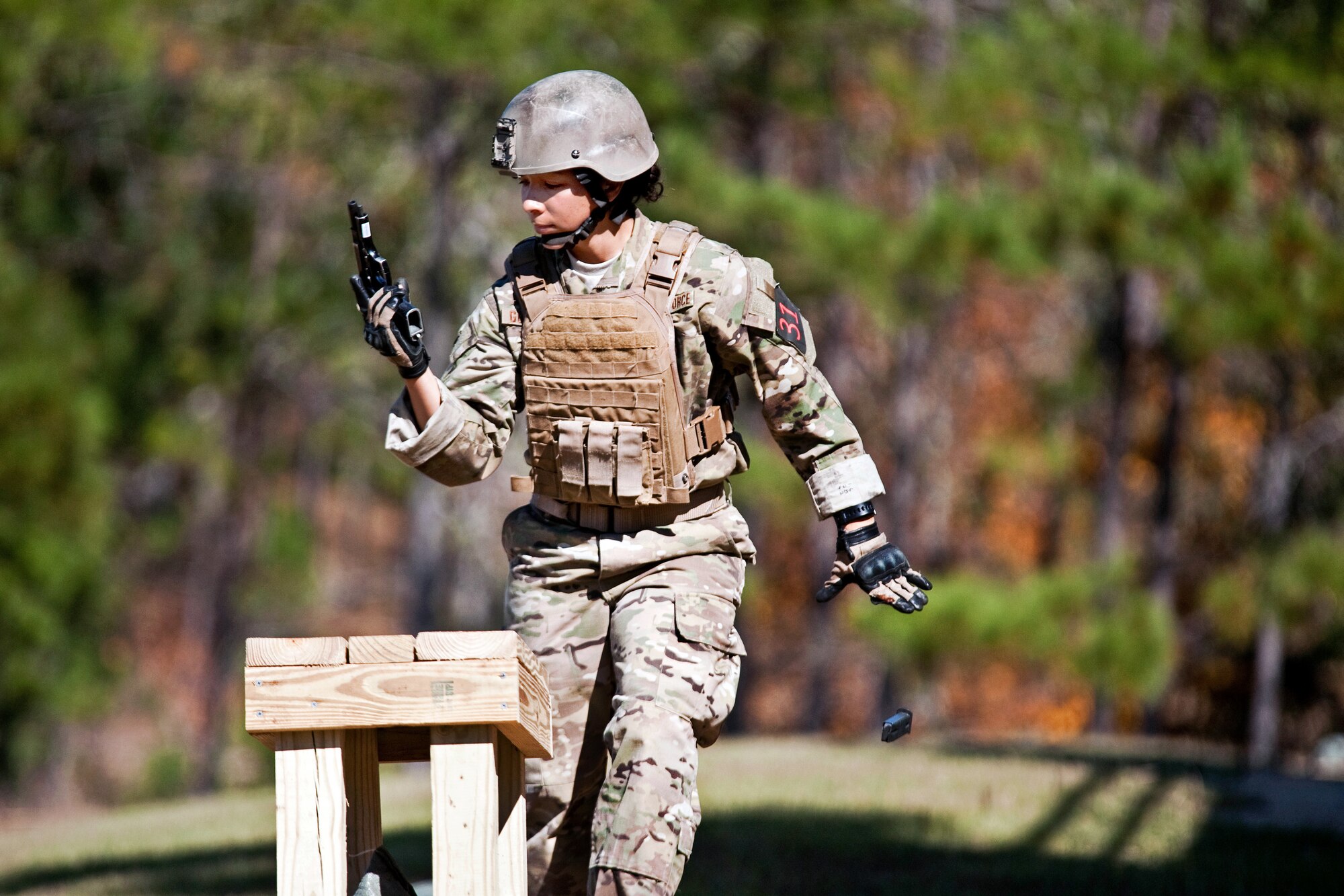 Photo of Airman with pistol