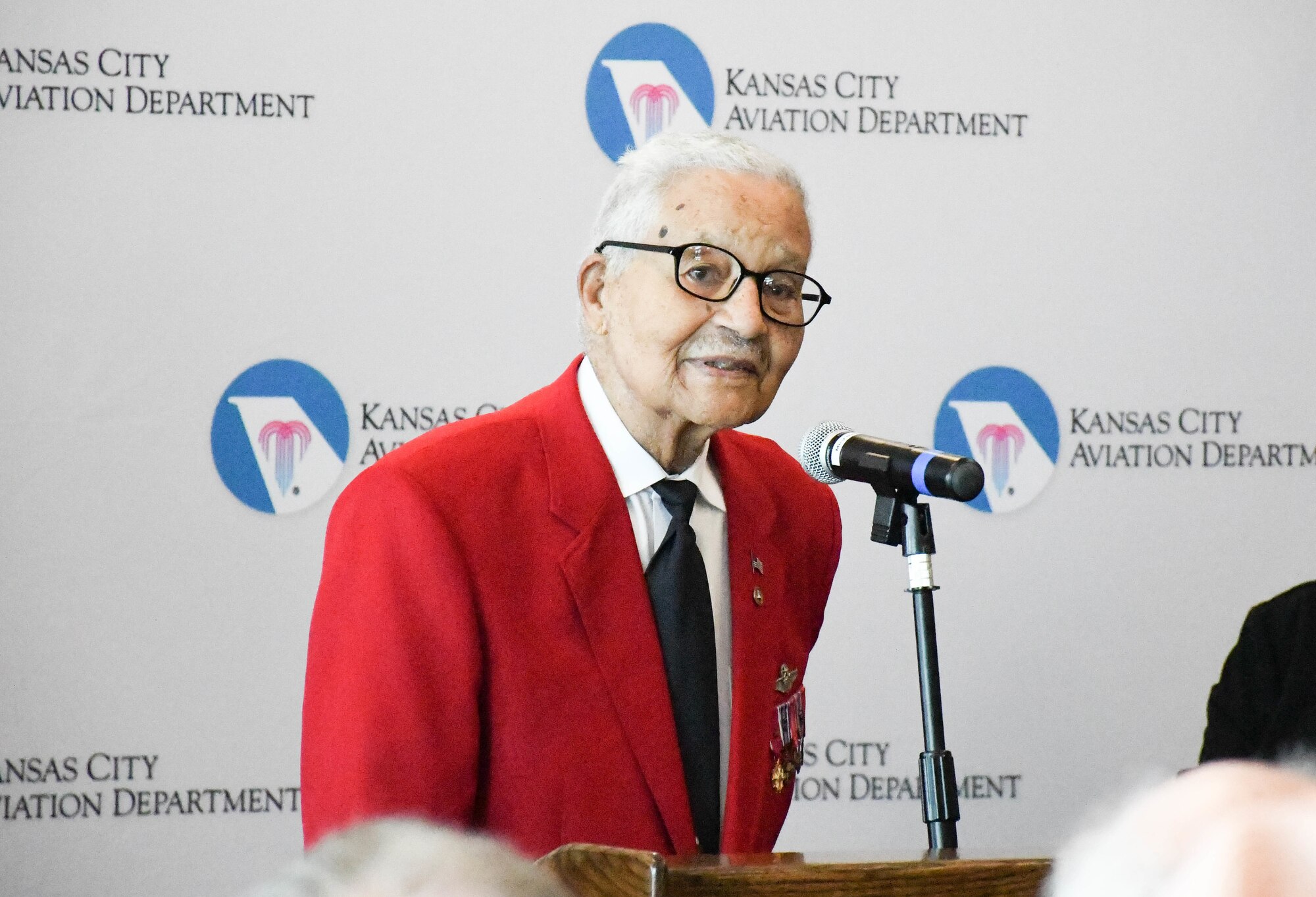 Tuskegee Airman retired Brig. Gen. Charles E. McGee speaks at the ceremony dedicating the Charles B. Wheeler Downtown Airport’s general aviation terminal in his honor