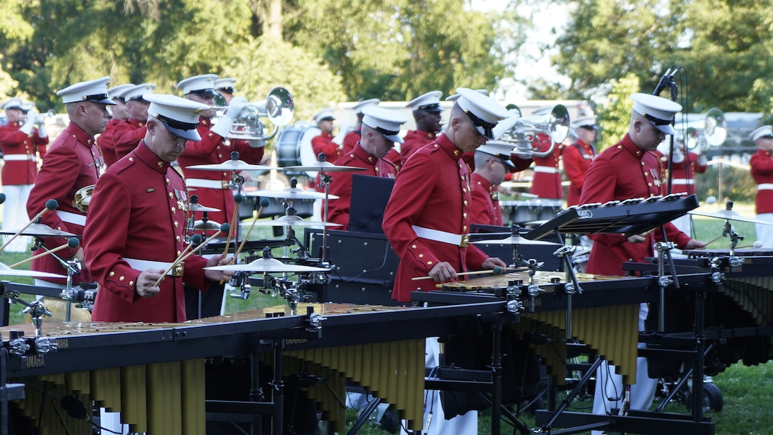 Marines with “The Commandant’s Own,” U.S. Marine Drum and Bugle Corps, perform during a Tuesday Sunset Parade at the Marine Corps War Memorial, Arlington, Va., June 29, 2021.