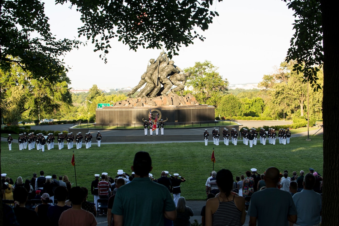 The Official U.S. Marine Corps Color Guard presents the National Ensign during a Tuesday Sunset Parade at the Marine Corps War Memorial, Arlington, Va., June 29, 2021. The hosting official for the evening was Brig. Gen. Michael J. Borgschulte, Director, Manpower Management Division, and The Honorable James F. Geurts Under Secretary of the Navy, was the guest of honor. (U.S. Marine Corps photo by Lance Cpl. Allen Sanders)