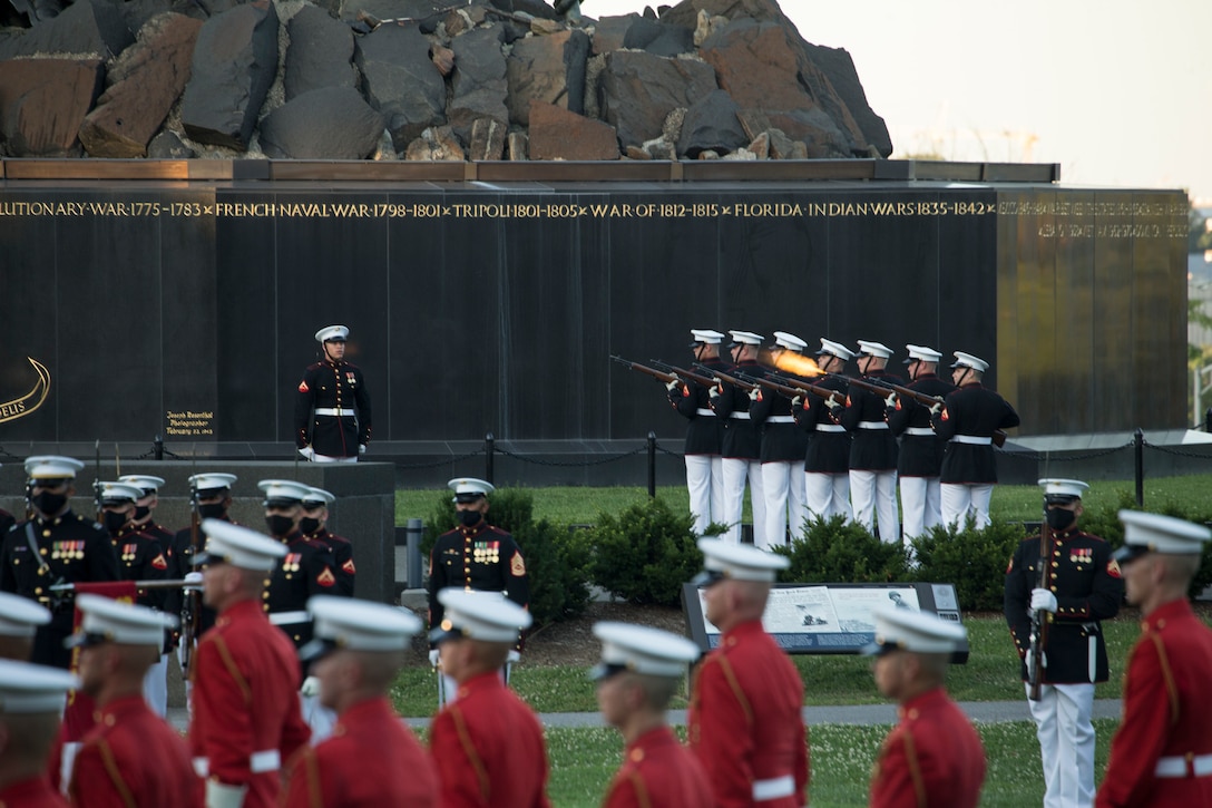 Marines with Marine Barracks Washington conduct their “three-round volley” during a Tuesday Sunset Parade at the Marine Corps War Memorial, Arlington, Va., June 29, 2021. The hosting official for the evening was Brig. Gen. Michael J. Borgschulte, Director, Manpower Management Division, and The Honorable James F. Geurts Under Secretary of the Navy, was the guest of honor. (U.S. Marine Corps photo by Lance Cpl. Allen Sanders)
