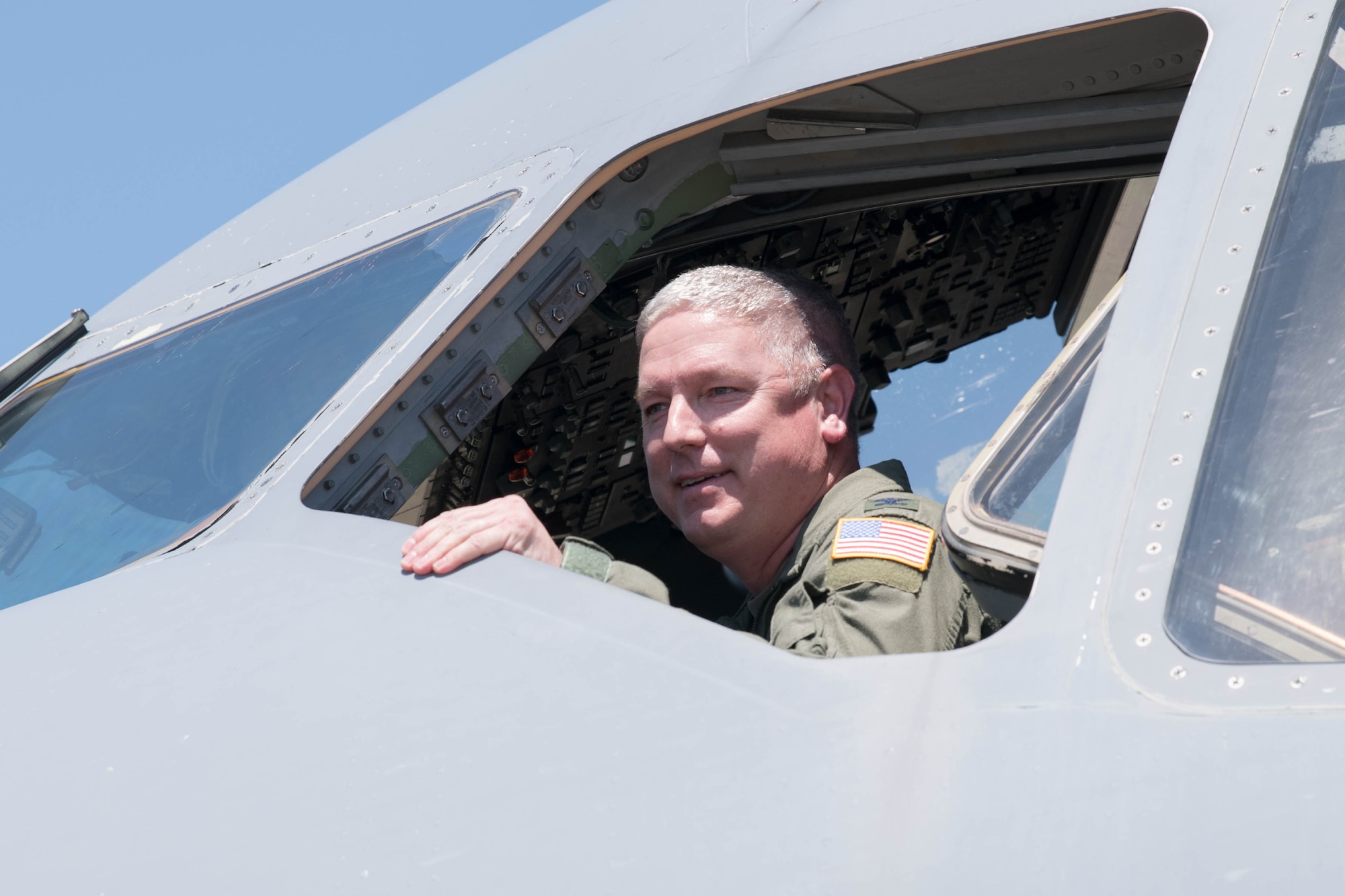Col. Mike Peeler, 436th Operations Group commander, looks out of the window of a C-17 Globemaster III following his final flight as group commander at Dover Air Force Base, Delaware, June 30, 2021. Peeler served as commander for two years. (U.S. Air Force photo by Mauricio Campino)