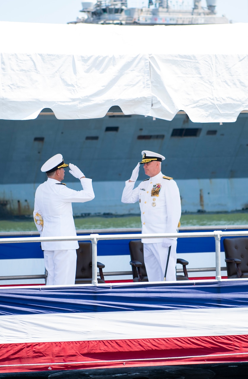 Vice Adm. David M. Kriete, left, deputy commander, U.S. Fleet Forces Command (USFFC) asks Adm. Christopher W. Grady, commander, USFFC, to go ashore for the final time during his retirement ceremony on board USS New Hampshire (SSN-78).