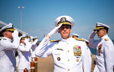 Vice Adm. David M. Kriete, center, deputy commander, U.S. Fleet Forces Command (USFFC) passes through the side boys during his retirement ceremony on board USS New Hampshire (SSN-78).