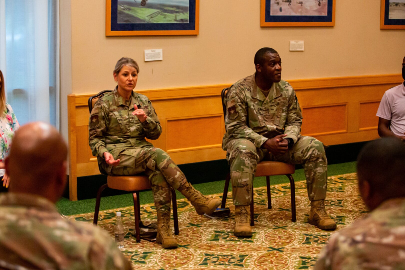 Brig. Gen. Caroline Miller and Command Chief Master Sgt. Wendell Snider speak to a roundtable group of participants about PTSD during the "Tough Conversation" event.