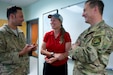 Alaska Air National Guardsmen of 210th Rescue Squadron, Tech. Sgt. Anthony Guedea (left) and Lt. Col. Michael Jordan meet with Iditarod musher Aliy Zirkle June 28, 2021, at Joint Base Elmendorf-Richardson, Alaska. Guedea and Jordan were part of the team that rescued Zirkle March 9 at the Iditarod Rohn checkpoint after she suffered a head injury.