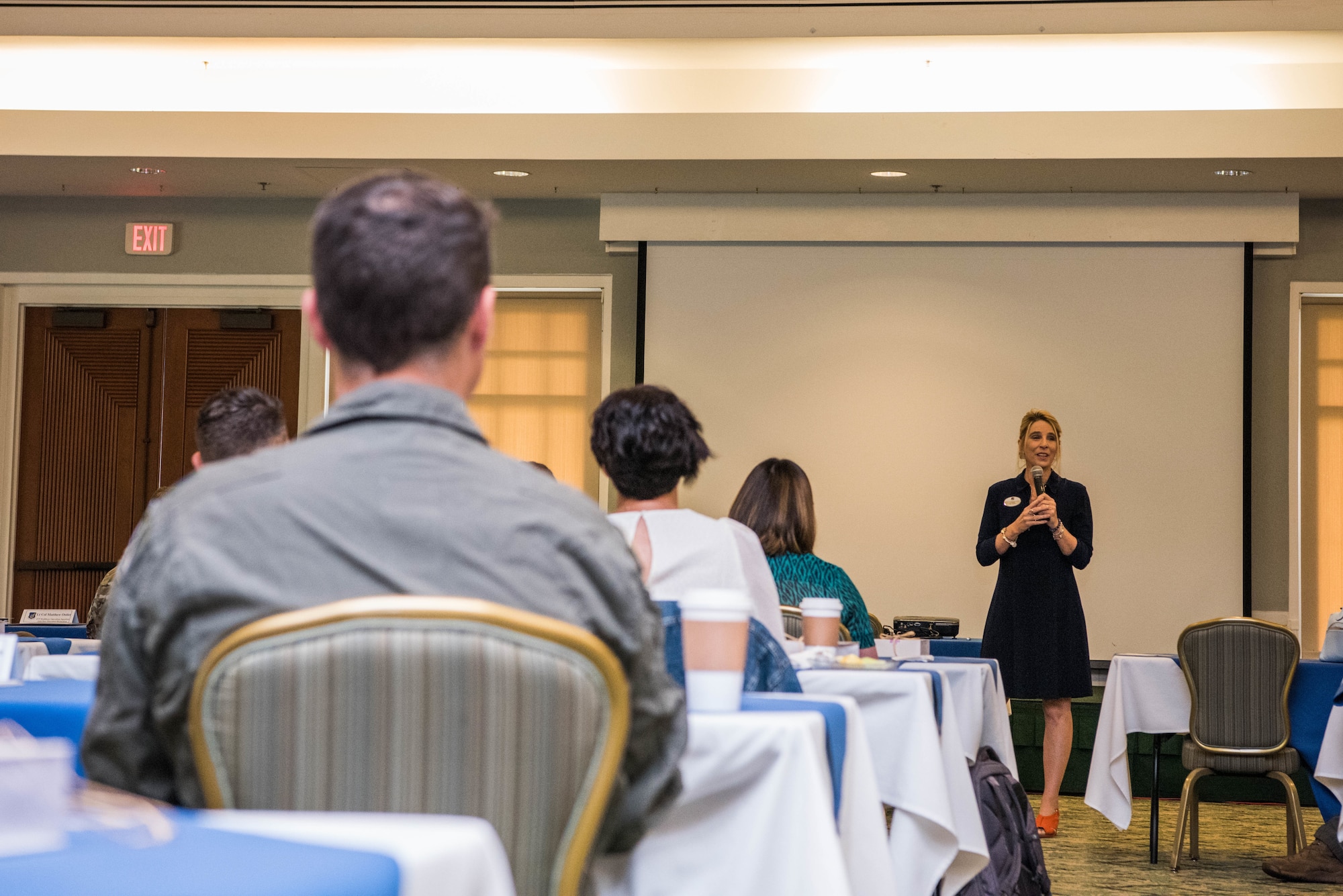 Cindy Wilsbach, First Lady of Pacific Air Forces (PACAF) and PACAF Spouses Club President, speaks during a PACAF Squadron Commander Course and Spouses Orientation, Joint Base Pearl Harbor-Hickam, Hawaii, June 21, 2021. The course was attended by squadron commanders preparing to take command within PACAF and their spouses. Spouses were invited to attend in order to receive insight and mentorship for the challenges they may face alongside their partners.  (U.S. Air Force photo by Staff Sgt. Hailey Haux)