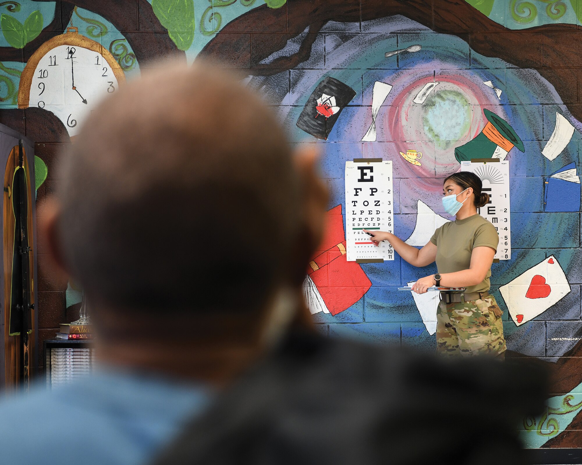 Senior Airman Jailen Dittman, 445th Aeromedical Staging Squadron medical technician, gives an eye exam to a patient at Warren County High School, Waynesboro, Georgia, as part of East Central Georgia Medical Innovative Readiness Training on June 10, 2021