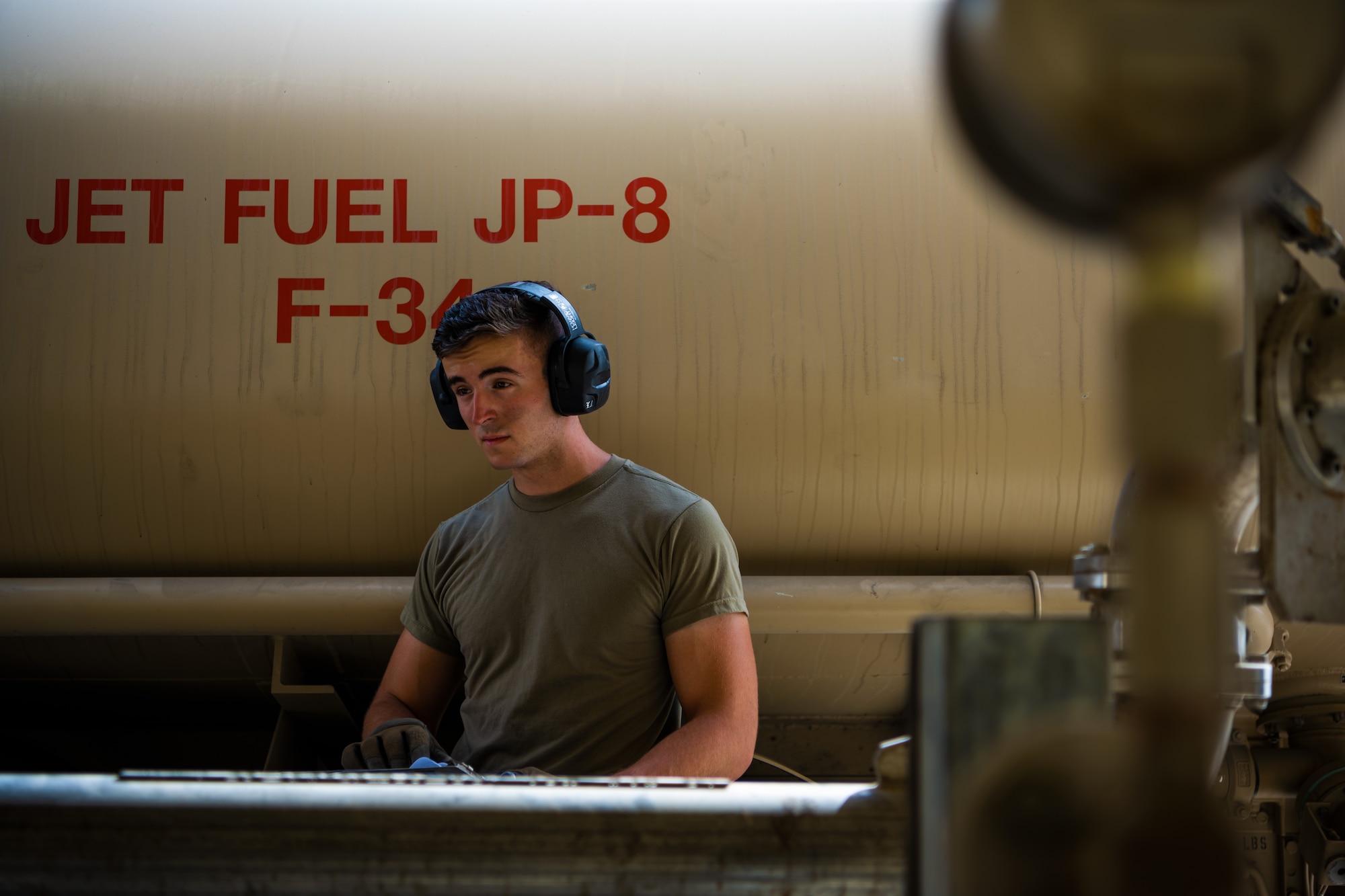 U.S. Air Force Senior Airman Robert Waldbillig, 380th Expeditionary Logistics Readiness Squadron fuels distributor,  fuels aircraft at Al Dhafra Air Base, United Arab Emirates, June 23, 2021.