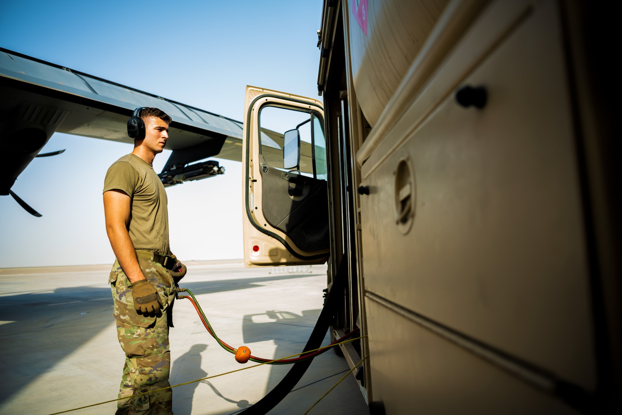 U.S. Air Force Senior Airman Robert Waldbillig, 380th Expeditionary Logistics Readiness Squadron fuels distributor,  fuels aircraft at Al Dhafra Air Base, United Arab Emirates, June 23, 2021.