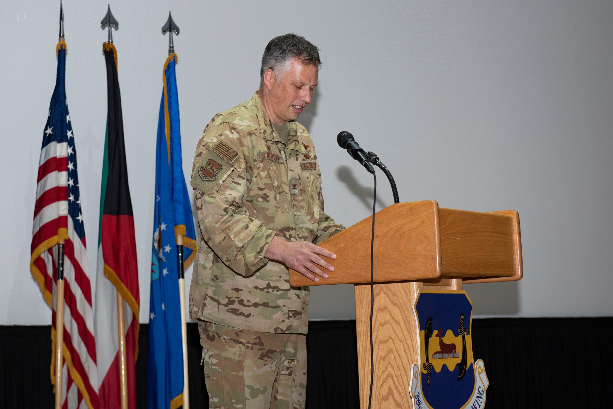 A photo of an Airman delivering remarks during a ceremony