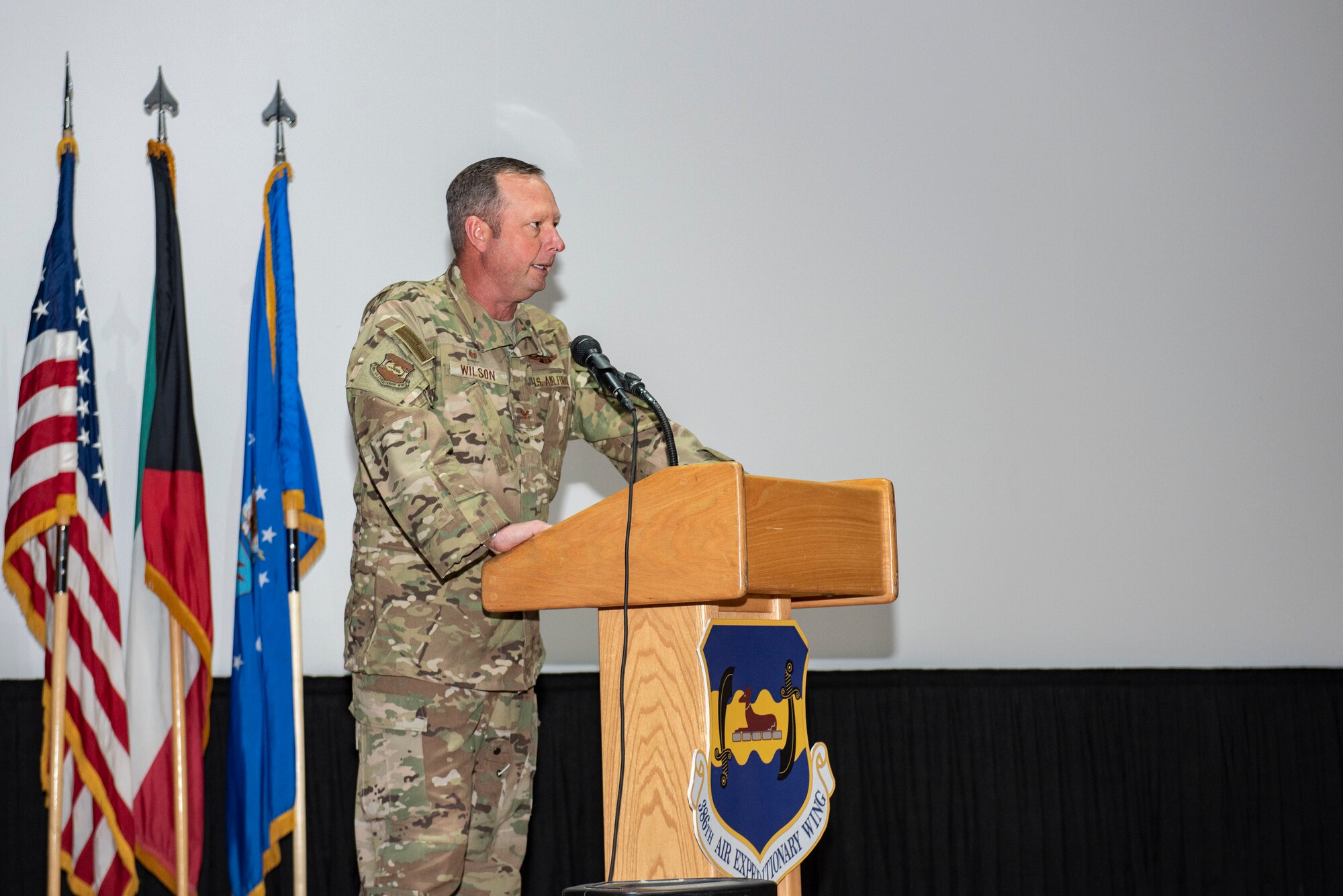 A photo of an Airman delivering remarks during a ceremony