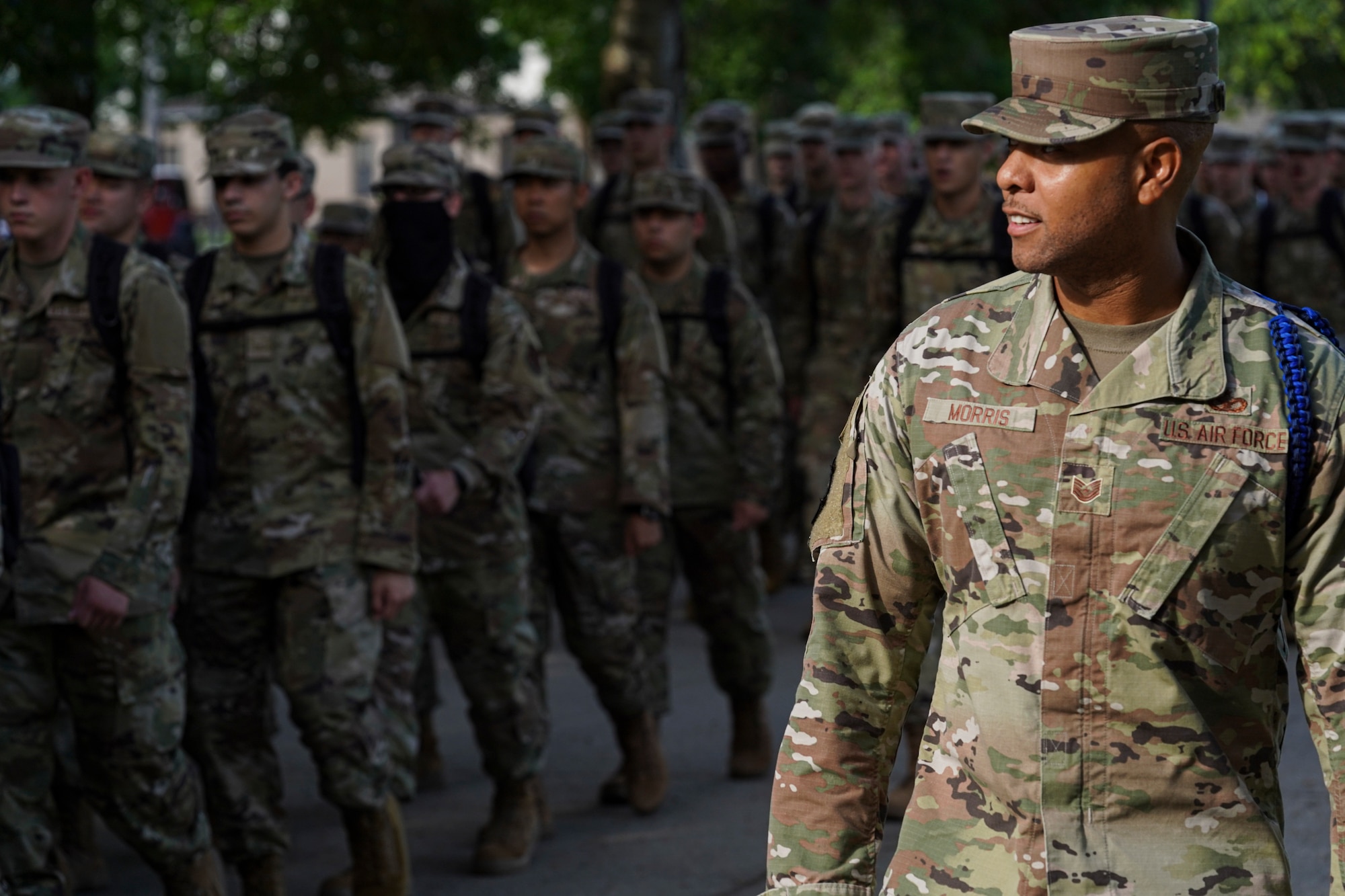 U.S. Air Force Tech. Sgt. Alvin Morris, 336th Training Squadron master military training leader, marches Airmen in training to school on Keesler Air Force Base, Mississippi, June 29, 2021. “I’ve been empowered with the tools to mold Airmen to be successful and to also challenge them to grow,” said Morris. “Understanding this pivotal role and short amount of time that I have to impact each Airman keeps me ready to mentor, train and lead at all times. Developing our Airmen, and watching them grow into leaders is very fulfilling for my position.” (U.S. Air Force photo by Senior Airman Spencer Tobler)